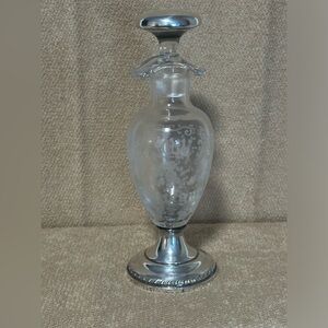 Antique etched glass oil and vinegar with sterling lid and base.